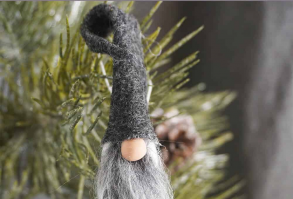 This is the CUTEST handmade ornament idea. It's such a simple DIY and I love these little miniature gnomes from glove fingers so much, I think I need a ton! Click through to get the mini gnome ornament tutorial and make a gnome in minutes! #gnome #gnomeornament #christmasgnome