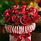 Place elastic band around jar & add candy canes under the band until you can no longer see the jar. Add roses & greenery for an inexpensive centerpiece or decoration,