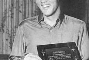 Elvis receives the award for his supporting work in Charity projects - at Graceland by members of the
