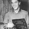 Elvis receives the award for his supporting work in Charity projects - at Graceland by members of the
