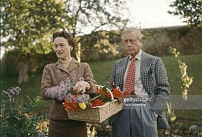 The Duchess (1896 - 1986) and Duke (1894 - 1972) of Windsor pick flowers on the grounds of their home, la Moulin de la Tuilerie, in the commune of Gif-sur-Yvette, outside of Paris, France, 1955.