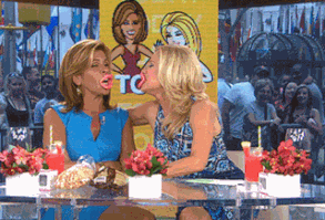 Kathie Lee Gifford and Hoda Kotb kissing with wax lips.