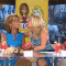 Kathie Lee Gifford and Hoda Kotb kissing with wax lips.