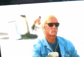 This guy THROWING AN ACTUAL DOG INTO THE WATER: | 17 Background Actors Who Have No Idea What They Are Doing